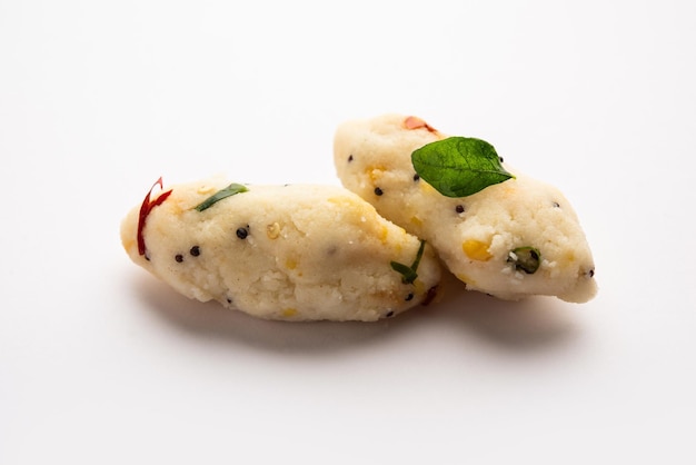 Photo kozhukatta pidi is a steamed snack food from kerala rice flour with finger impressions