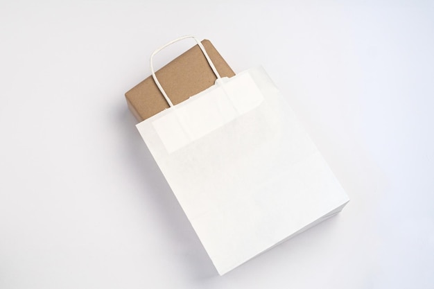 Kraft box inside a white paper bag