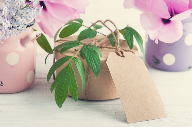 Kraft gift box, peonies and lilac flowers