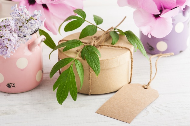 Kraft gift box, peonies and lilac flowers