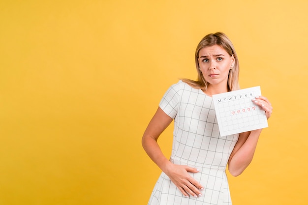 Foto krampen omdat menstruatie en menstruatiekalender