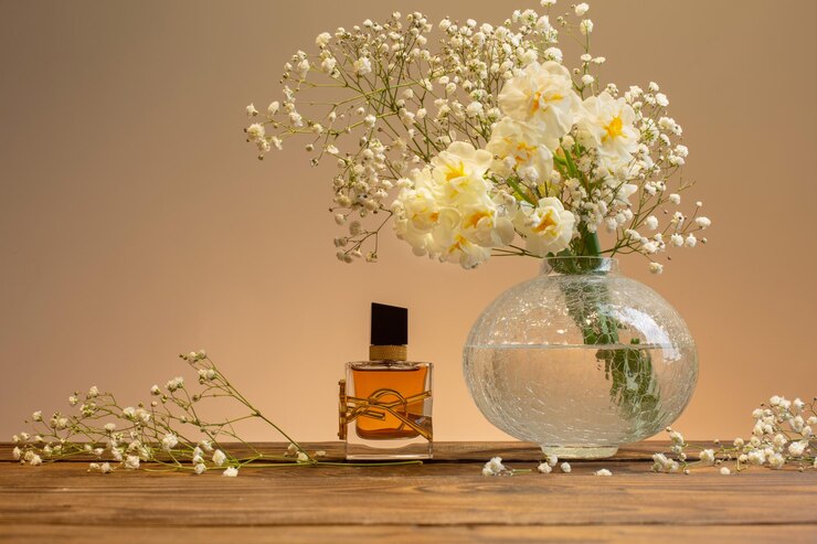 Krichev Belarus 16 February 2022 Yves Saint Laurent Libre Intense Eau de Parfum Fragrance with white flowers on wooden table