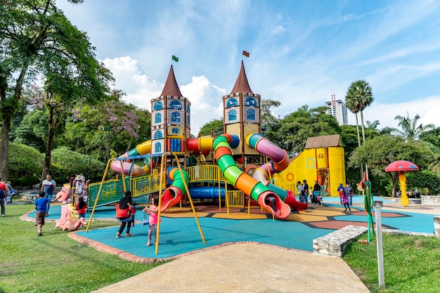 Photo kuala lumpurmalaysia 9 sep 2018 lake gardens also known as kuala lumpur perdana botanical gardenschildren can seen playing the playground which is located at the gardens