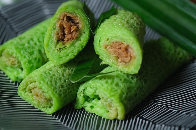 kue dadar gulung, a dessert made of glutinous rice, coconut and palm sugar. popular in Malaysia.