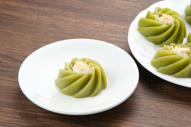 Kue Kaswi Pandan traditional cake made from tapioca flour and pandan leaf topping with sesame seed