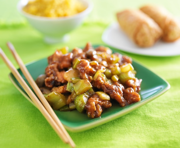 Kung pao chicken on green plate