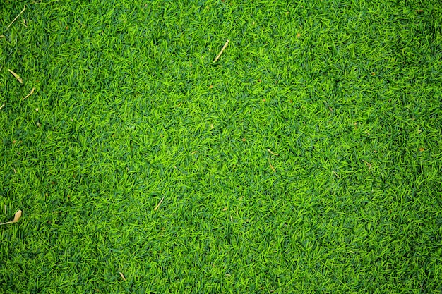 Kunstmatige groene grastextuur met vintage filter kan als achtergrond worden gebruikt