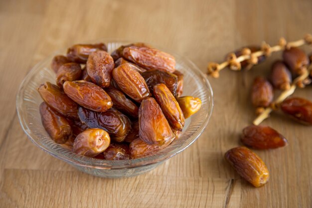 Kurma or dates on wooden background