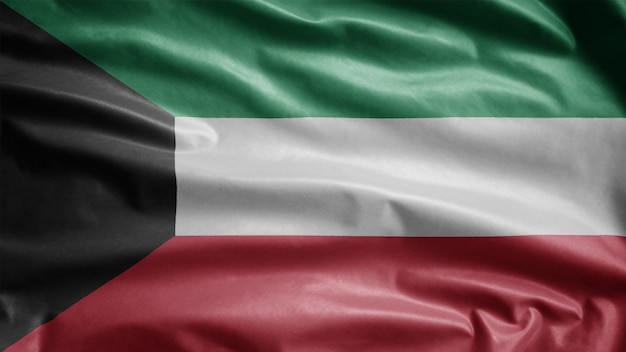 Kuwaiti flag waving in the wind. Close up of Kuwait banner blowing, soft and smooth silk. Cloth fabric texture ensign background.