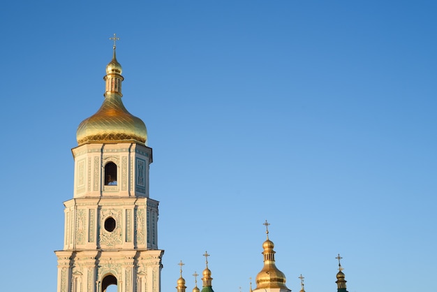 Kyiv (Kiev) is the capital of Ukraine. Bell tower of Saint Sophia's Cathedral against a clean blue sky. Sofia Square