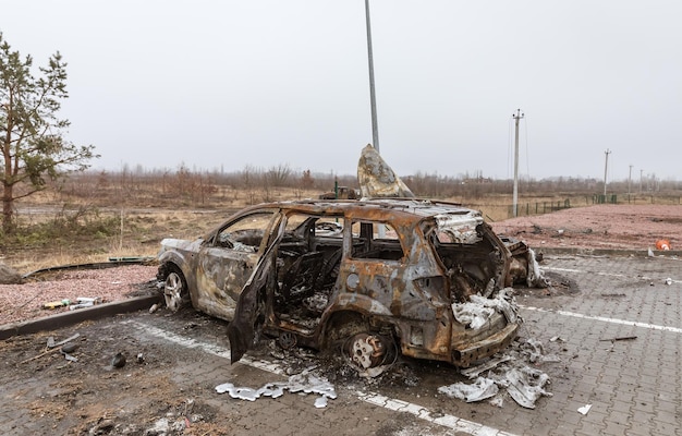 KYIV REG UKRAINE Apr 02 2022 A destroyed and burnt cars seen on a KyivZhytomyr highway 20 km from Kyiv