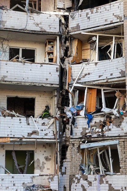 Kyiv ukraine mar 20 2022 war in ukraine residential building\
and cars damaged by falling debris after russian rocket attack on\
kyiv