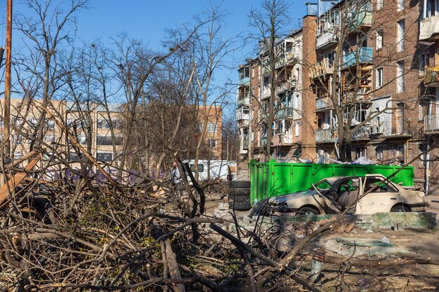 Kyiv ukraine mar 21 2022 war in ukraine residential building\
and cars damaged by falling debris after russian rocket attack on\
kyiv