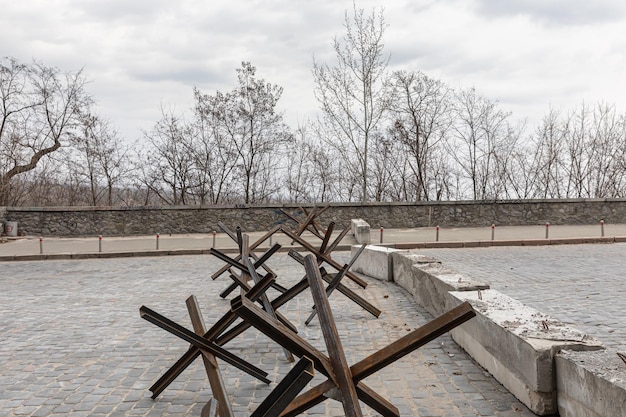 Kyiv ukraine mar 26 2022 war in ukraine deserted streets\
antitank hedgehogs and concrete barriers in kyiv streets of kyiv in\
wartime