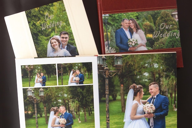 Kyiv Ukraine May 15 2019 Pages of wedding photobook or wedding album on black background