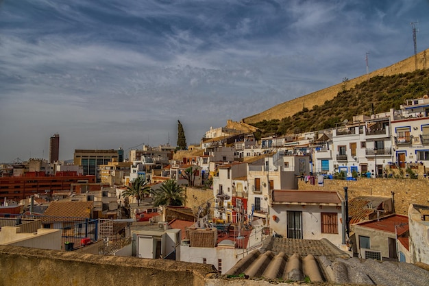 Photo l historic old colorful houses barrio santa cruz alicante spain on a sunny day