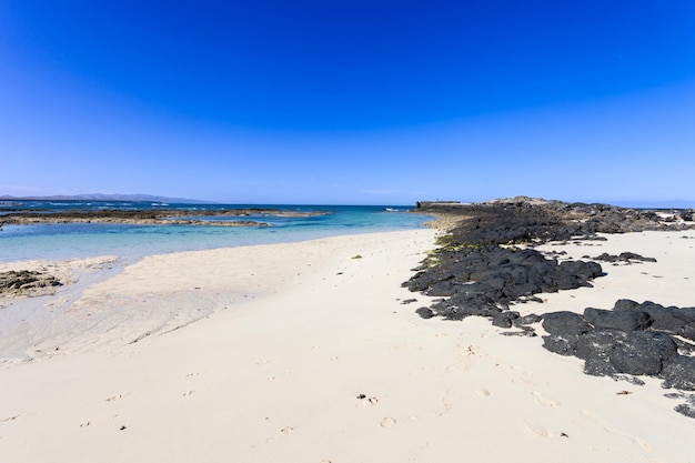 La Concha beach with crystal clear waters. It is located in the town of El Cotillo, Fuerteventura