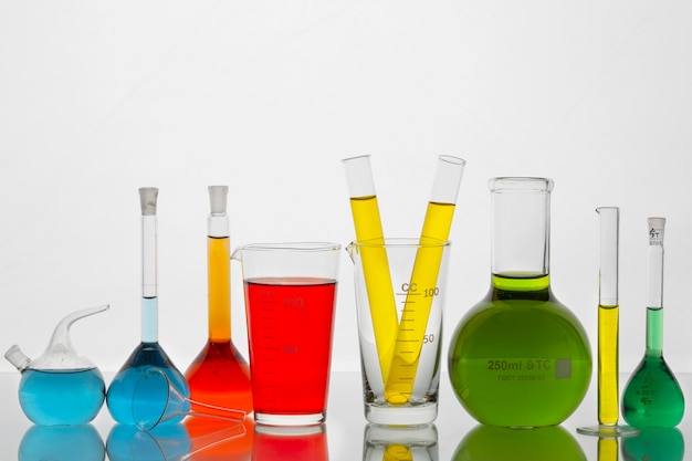 Lab glassware arrangement with colorful liquids