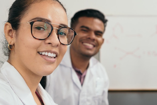 Lab technicians taking selfie in the lab smiling at the camera