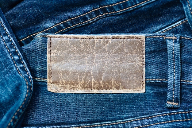 Label or leather label on jeans with space to copy Blank for applying information Casual clothing