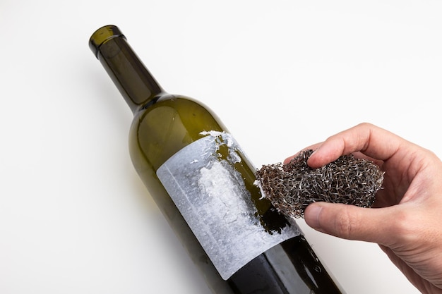 Label off a wine bottle with an iron sponge