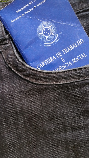 Photo labor brazilian portfolio in jeans pocket.