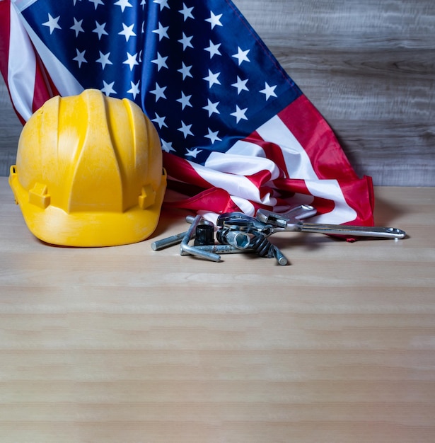 Photo labor day banner of tools and us flag still life