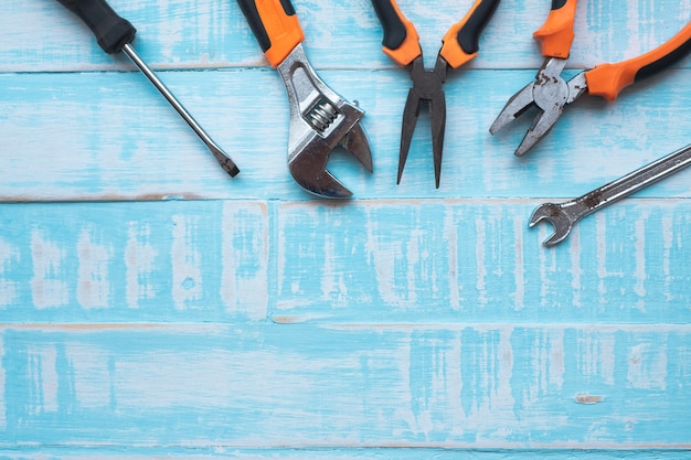  Labor day Concept. Construction tools on blue wooden surface.