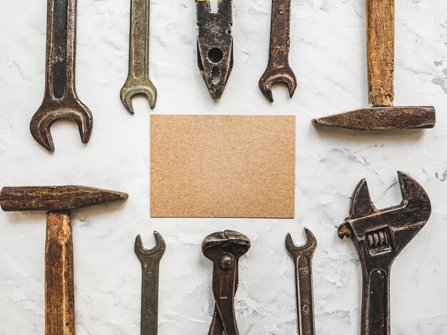 LABOR DAY. Hand tools lying on the table. View from above, close-up. Preparing for the celebration. Congratulations to loved ones, family, relatives, friends and colleagues. National holiday concept