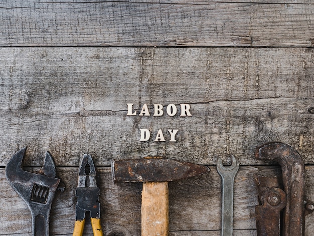 LABOR DAY. Hand tools and wooden letters