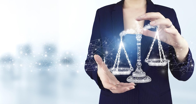 Labor Law Lawyer Legal Business. Two hand holding virtual holographic Labor Law icon with light blurred background. Justice law, attorney scale weight court, authority concept.