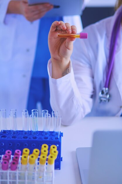 Laboratory assistant holding test tube