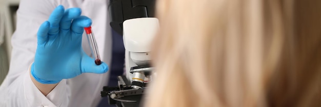 Laboratory assistant prepares blood for analysis for antibodies and viruses