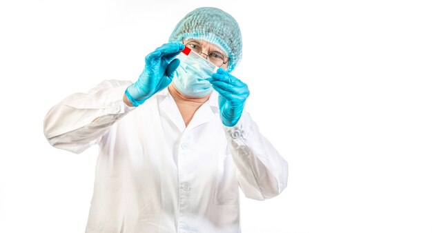 A laboratory assistant with test tube