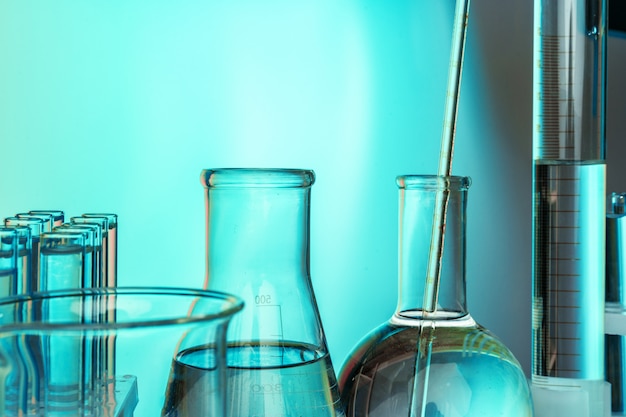 Laboratory chemistry glassware  on green toned background