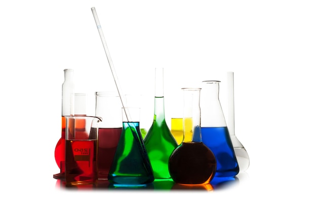 Laboratory glass with rainbow color liquids, chemistry still life