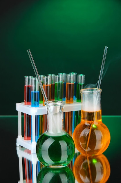 Laboratory glassware on dark color background