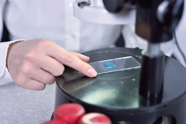 Laboratory worker examines a sample