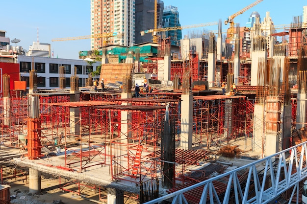 Laborers working on modern constraction site works in Bangkok Thailand.