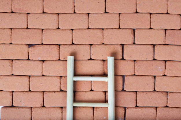 Ladder on a redbrick wall. Baackground.Closeup