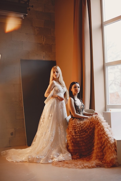 Ladies in evening dress. Elegant women in long gown.