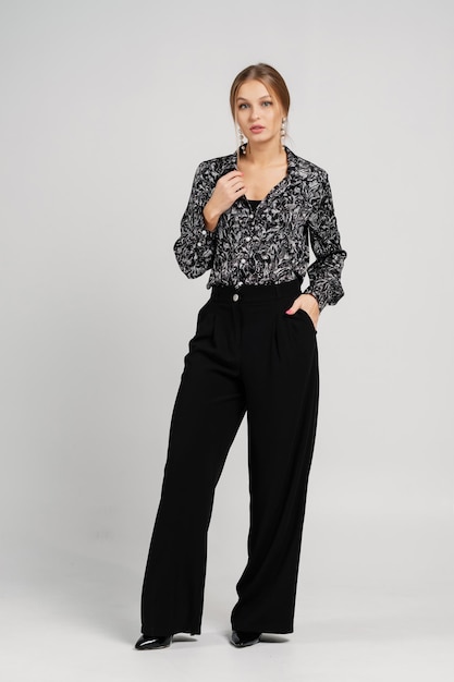 Lady in a blouse and trousers Studio female portrait