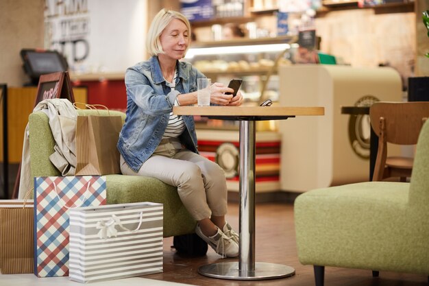 Lady drinking water in food court