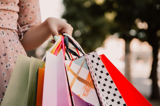 Lady hold many bags after shopping