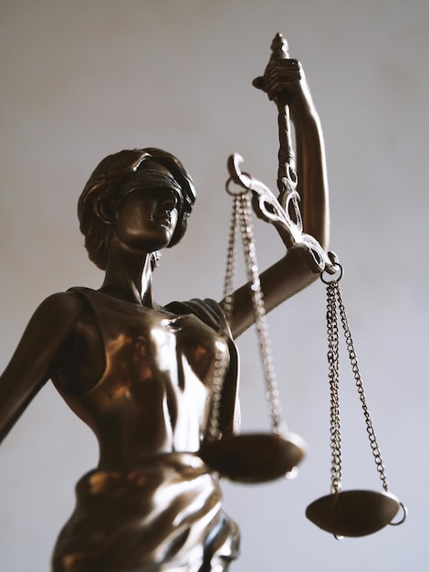 Lady justice or justitia figurine law and jurisdiction symbol