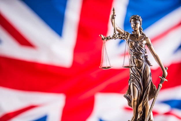 Lady Justice and United Kingdom flag. Symbol of law and justice with UK Flag. Brexit.