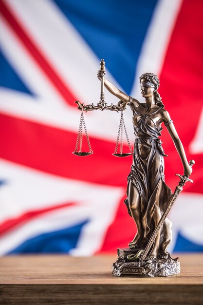 Lady Justice and United Kingdom flag. Symbol of law and justice with UK Flag. Brexit.