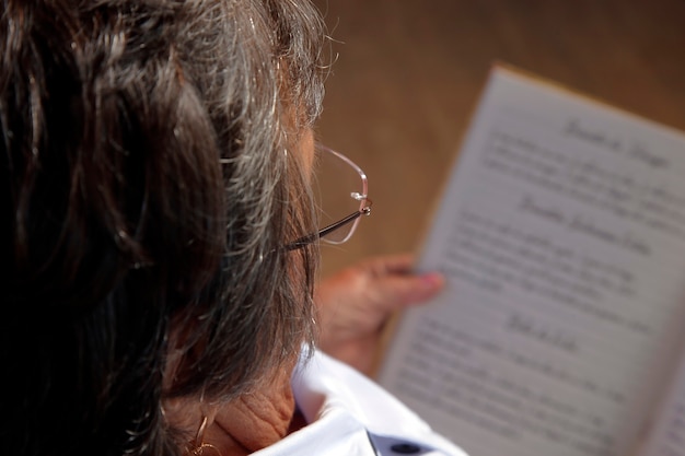 Lady reading with glasses