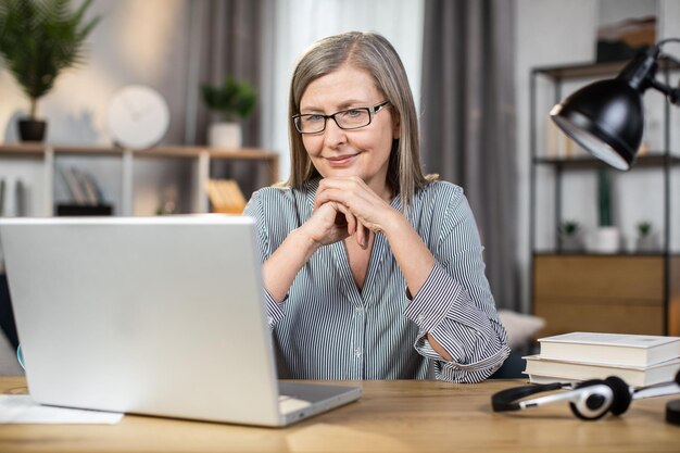 Lady taking part in online briefing in remote workplace