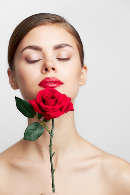 Lady with rose Closed eyes flower near the face cute face